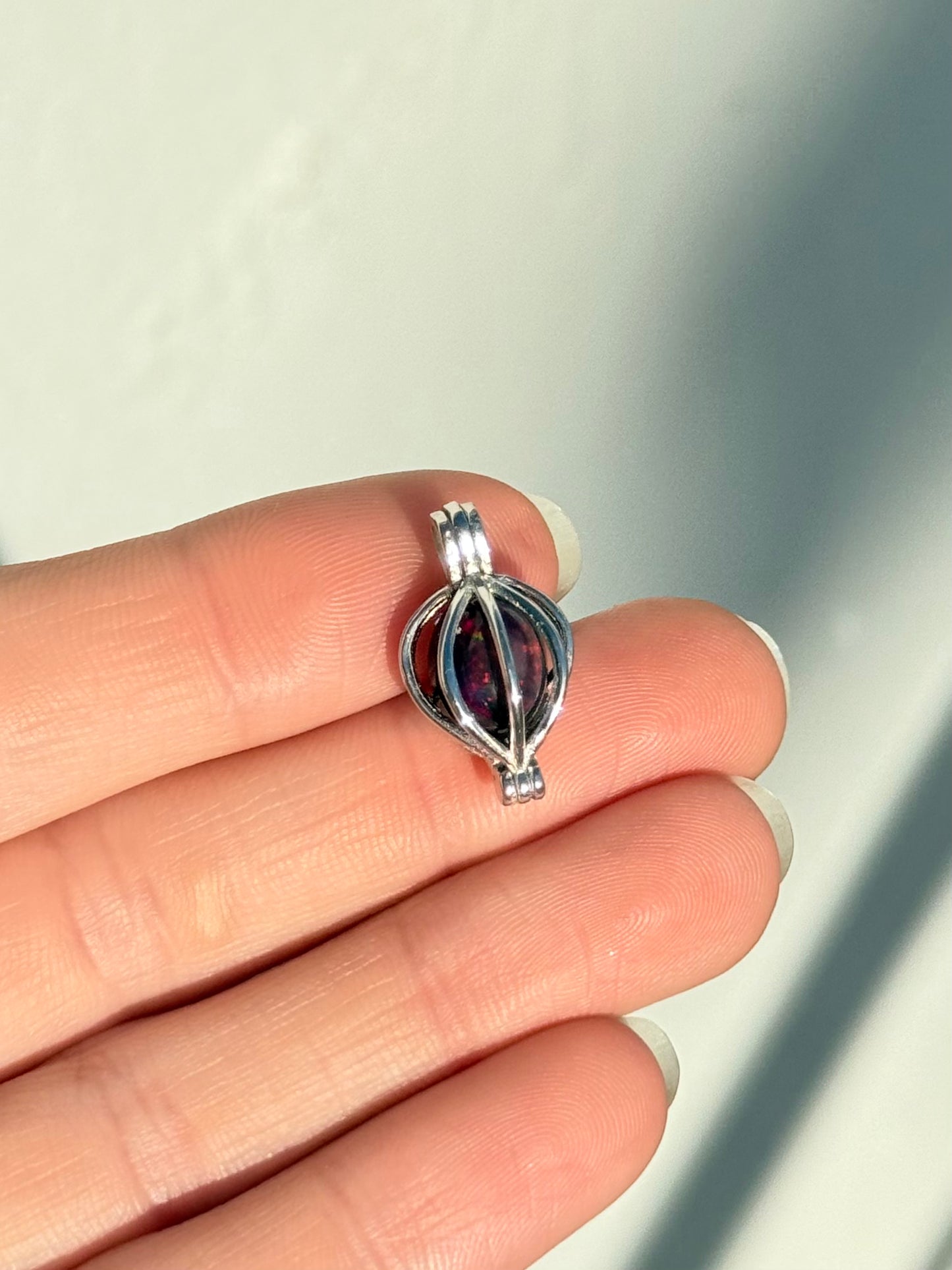 Black Treated Opal Pendant - Sterling Silver Cage Setting