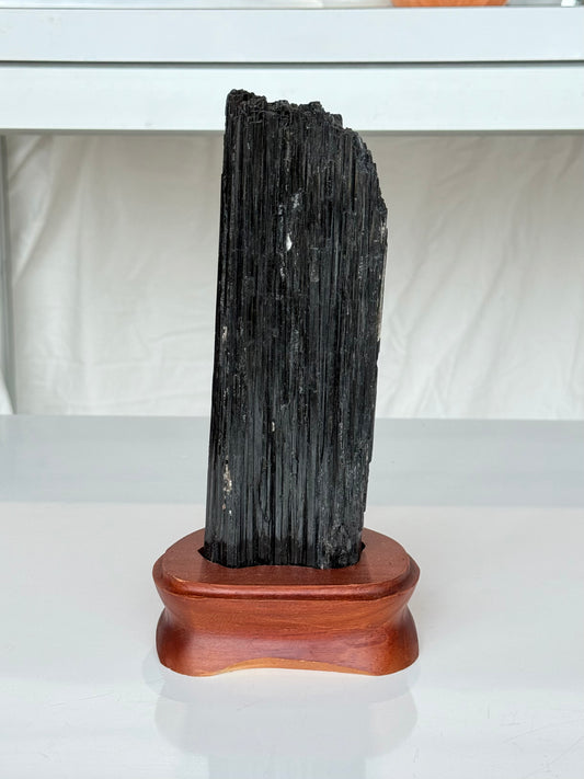 Black Tourmaline On wooden Stand
