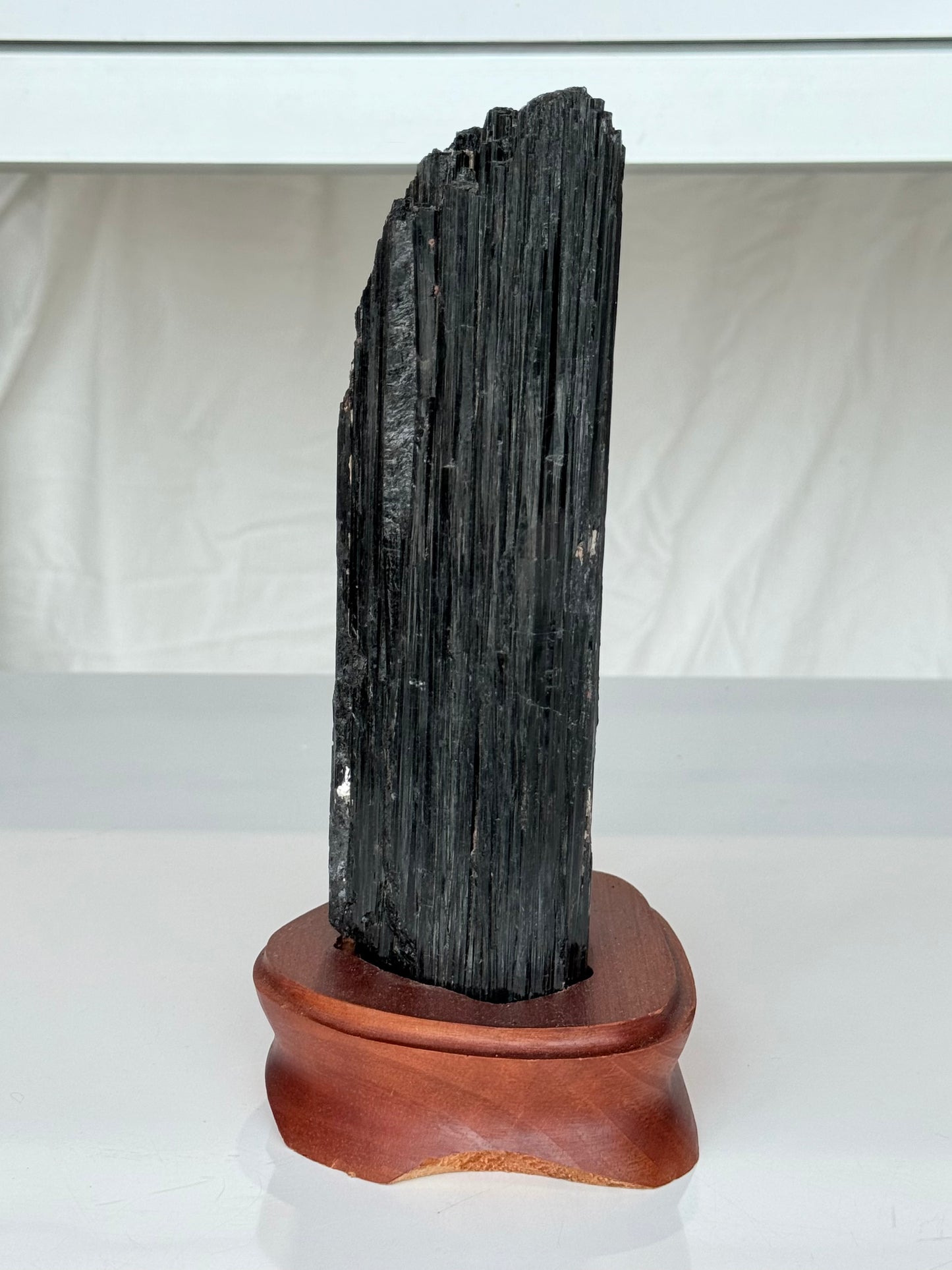 Black Tourmaline On wooden Stand