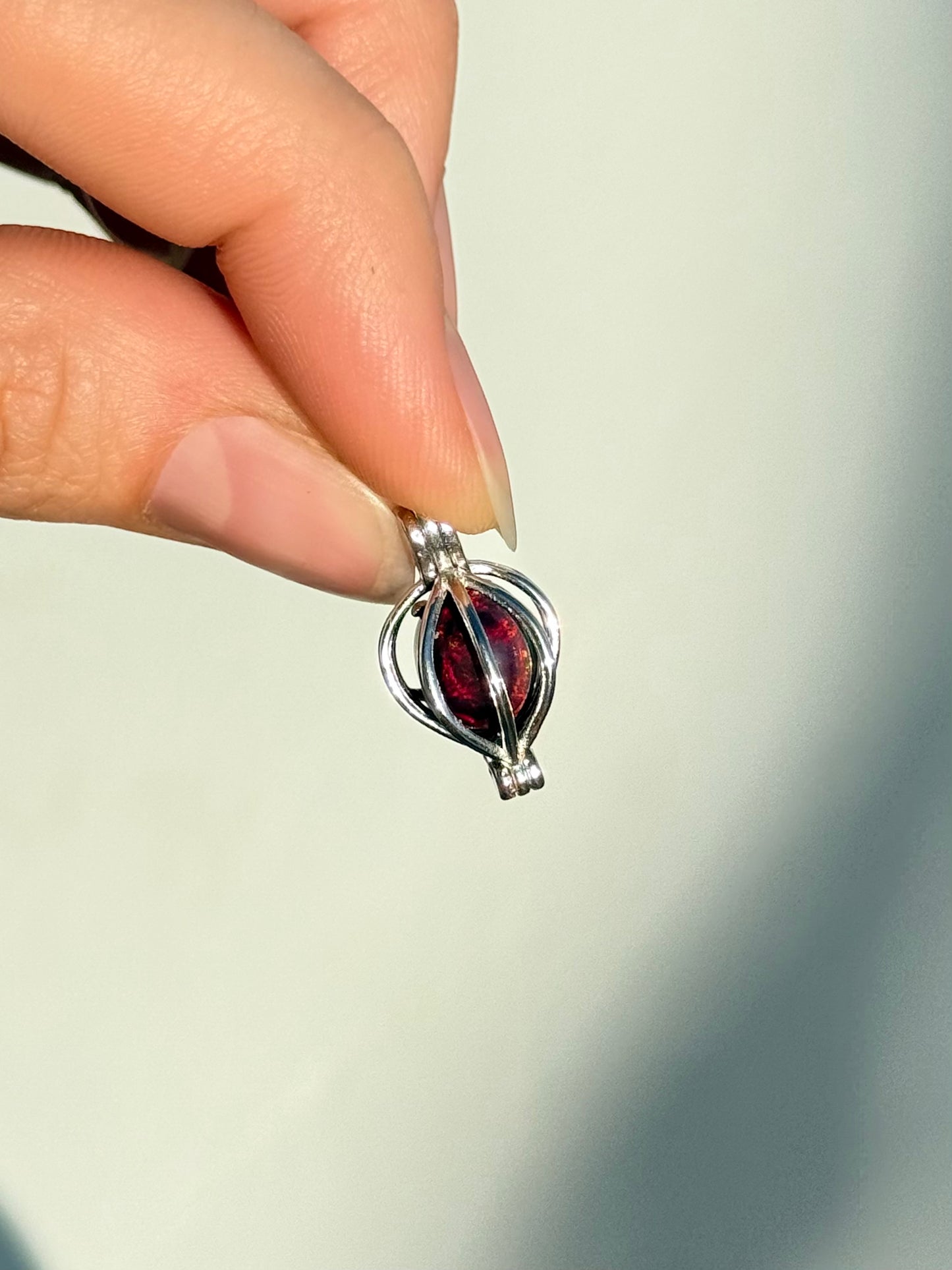Black Treated Opal Pendant - Sterling Silver Cage Setting